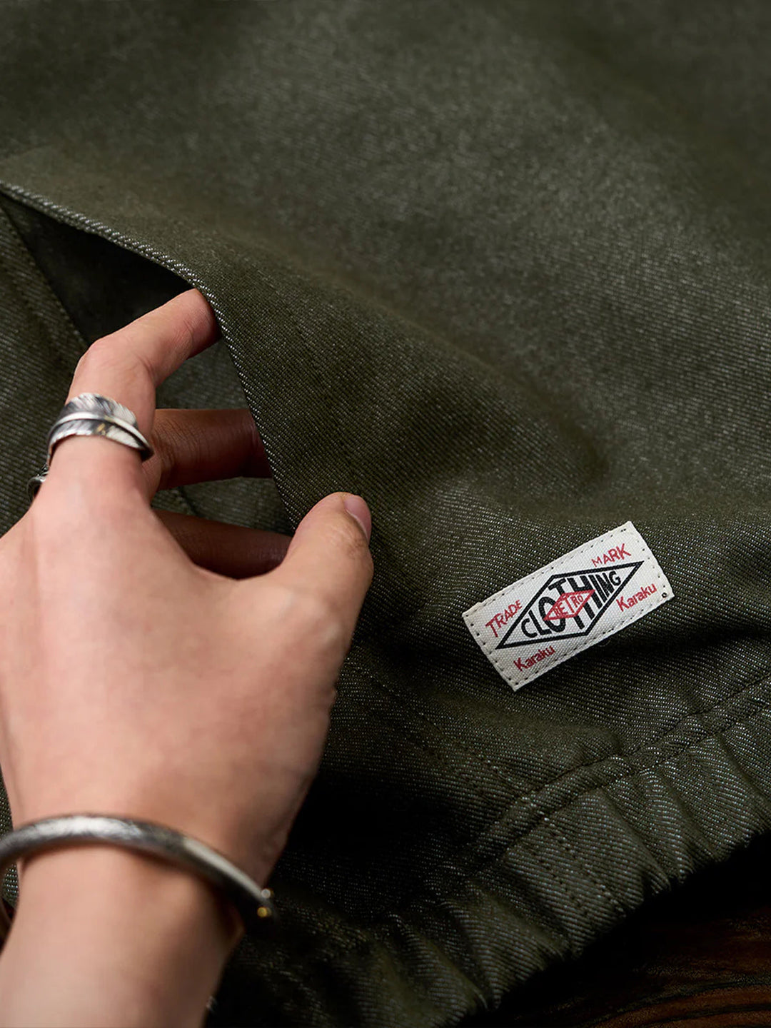 “KaraKu” Logo Embroidered Half-Zip Denim Sweatshirt with Navajo-Style Lining &amp; Elbow Patches